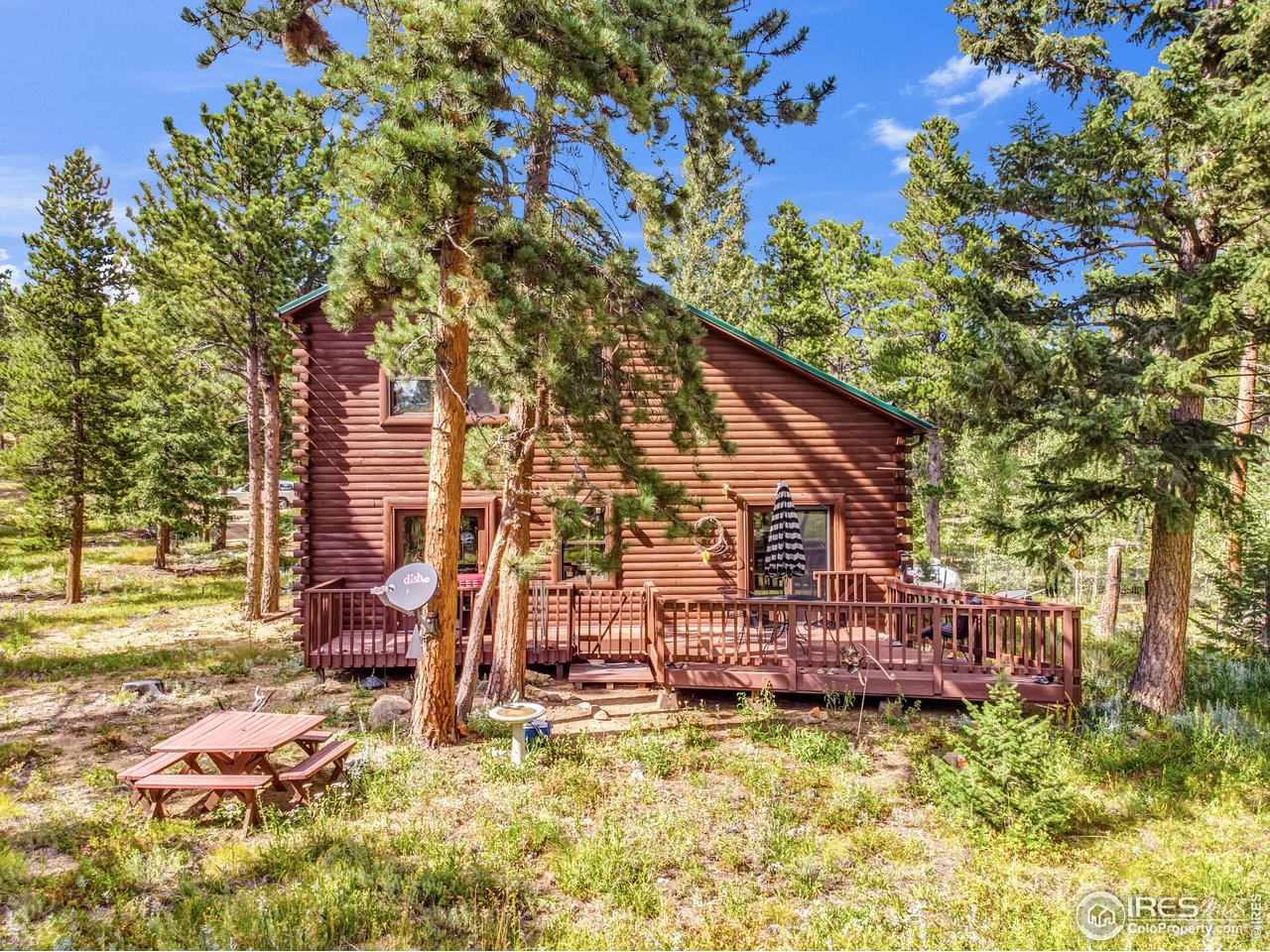 92 Tilghman Road Ward, CO 80481 - Photo 20 of 31 a view of a house with backyard porch and sitting area