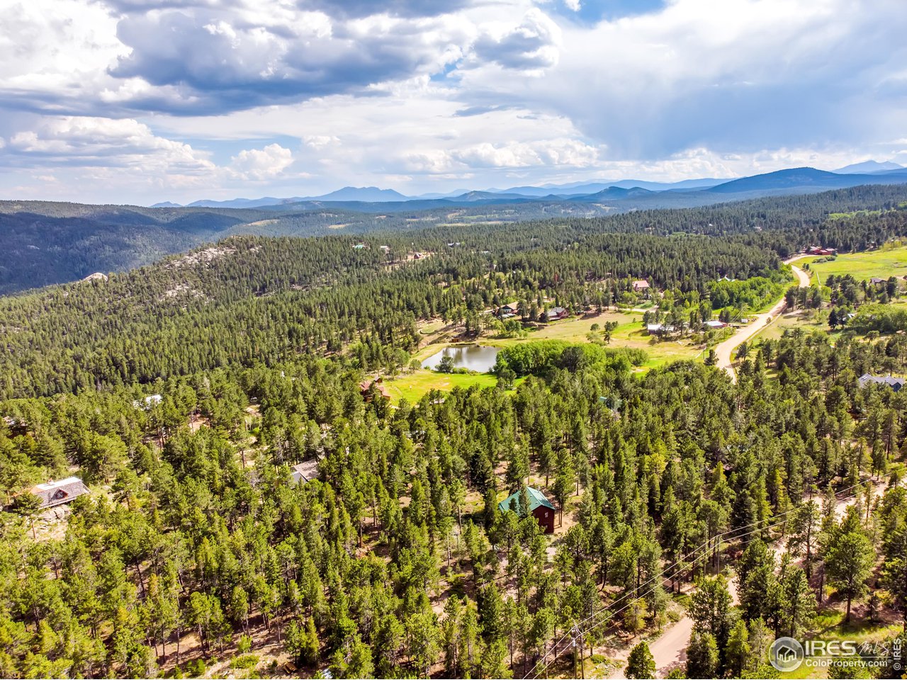 92 Tilghman Road Ward, CO 80481 - Photo 27 of 31 a view of a city with lush green forest