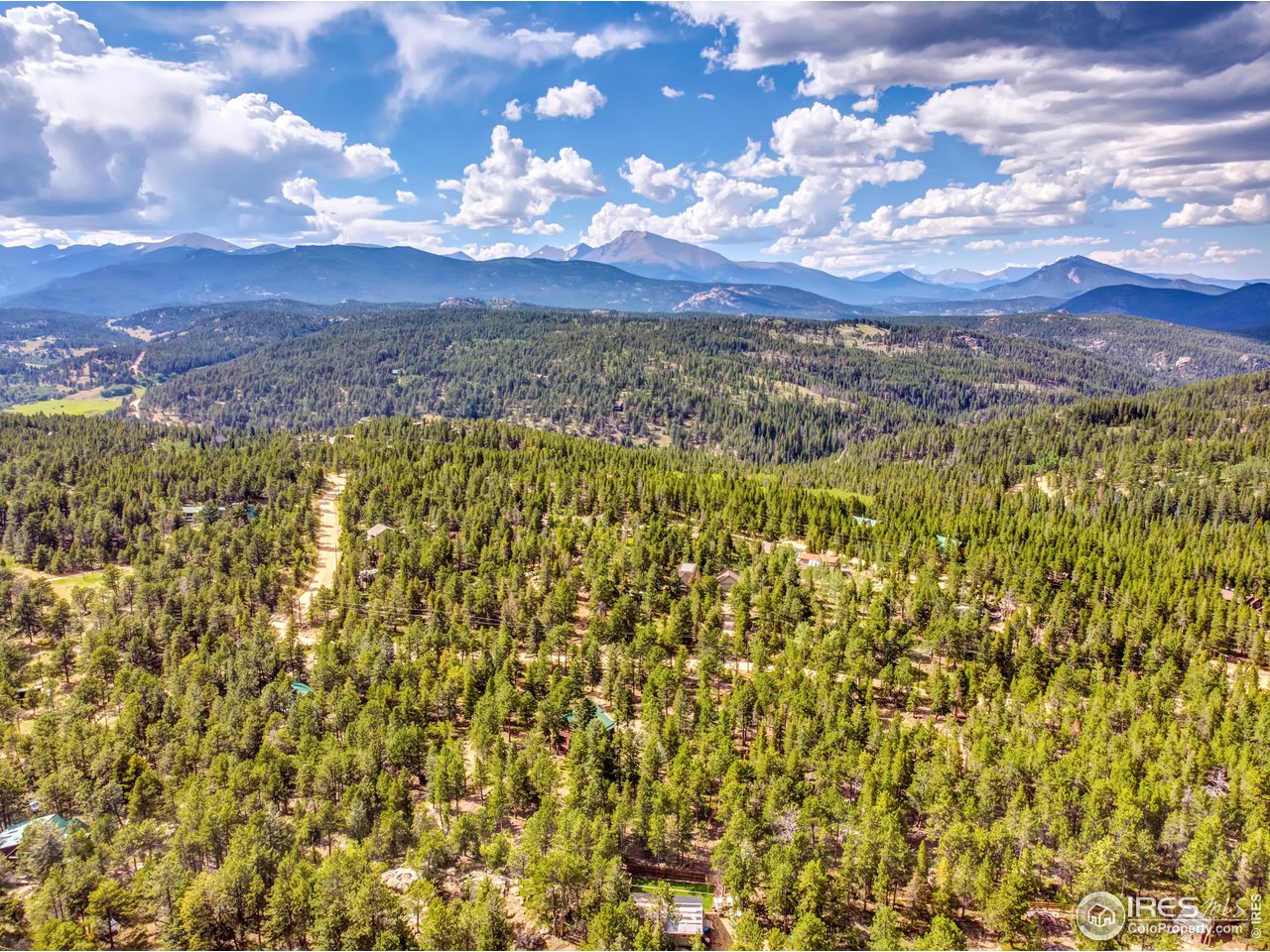 92 Tilghman Road Ward, CO 80481 - Photo 30 of 31 a view of a houses with a yard