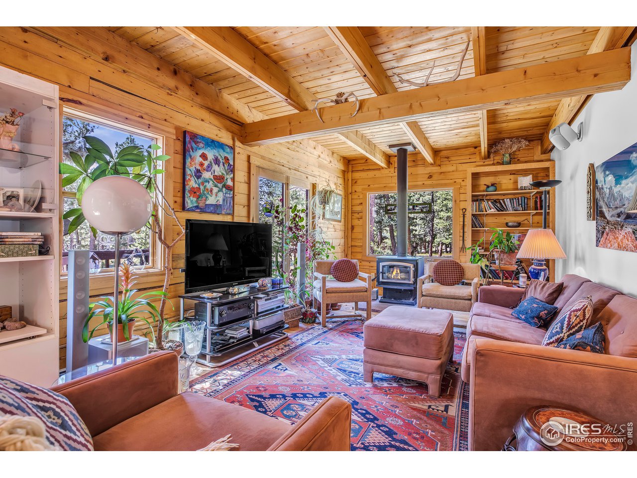 92 Tilghman Road Ward, CO 80481 - Photo 3 of 31 a living room with furniture and a flat screen tv