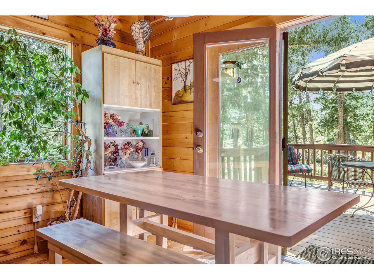92 Tilghman Road Ward, CO 80481 - Photo 9 of 31 a view of a chairs and table in the patio