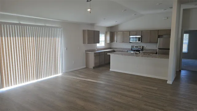 a view of a kitchen with a sink cabinets and window