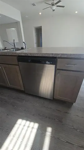 a view of room with a sink and wooden floor
