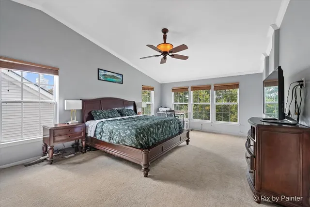 a bedroom with a bed dresser and a window