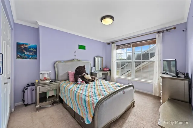 a bed room with a bed and a window