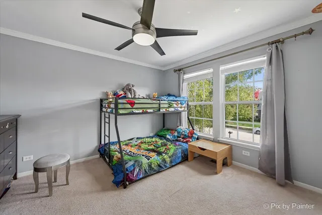 a bedroom with furniture and a chandelier
