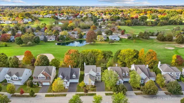 an aerial view of a house with outdoor space pool seating area and yard