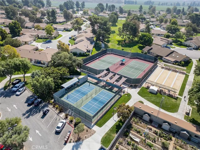 an aerial view of a house with a garden