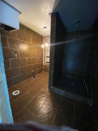 a bathroom with a glass shower door