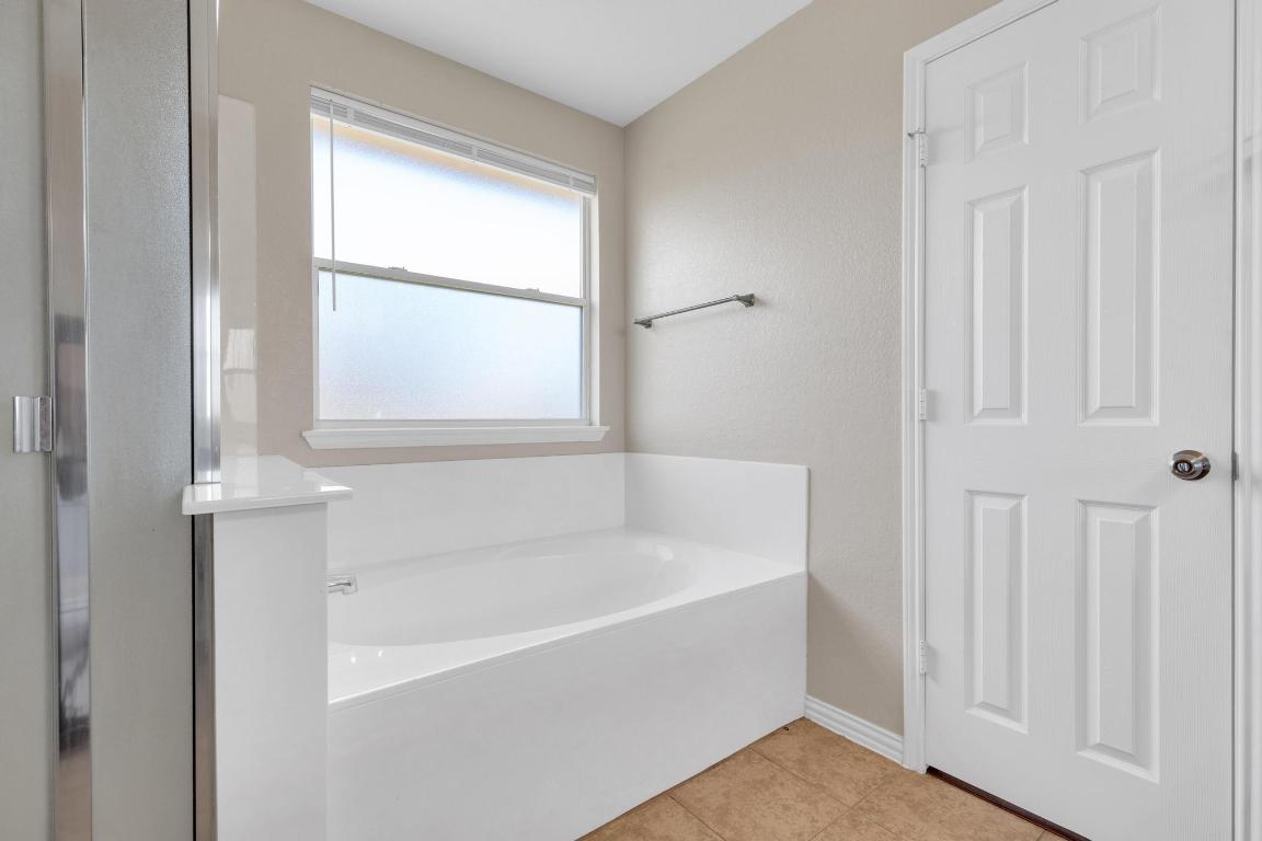 9301 Bellgrove Court Killeen, TX 76542 - Photo 12 of 22 a white bath tub sitting next to a window