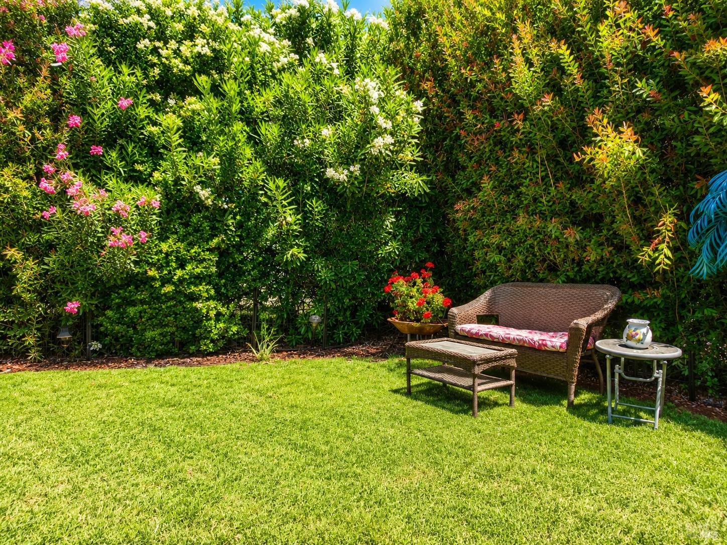 1945 Piner Road, Unit 16 Santa Rosa, CA 95403 - Photo 17 of 18 a backyard of a house with table and chairs