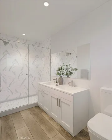 a bathroom with a sink a toilet and vanity