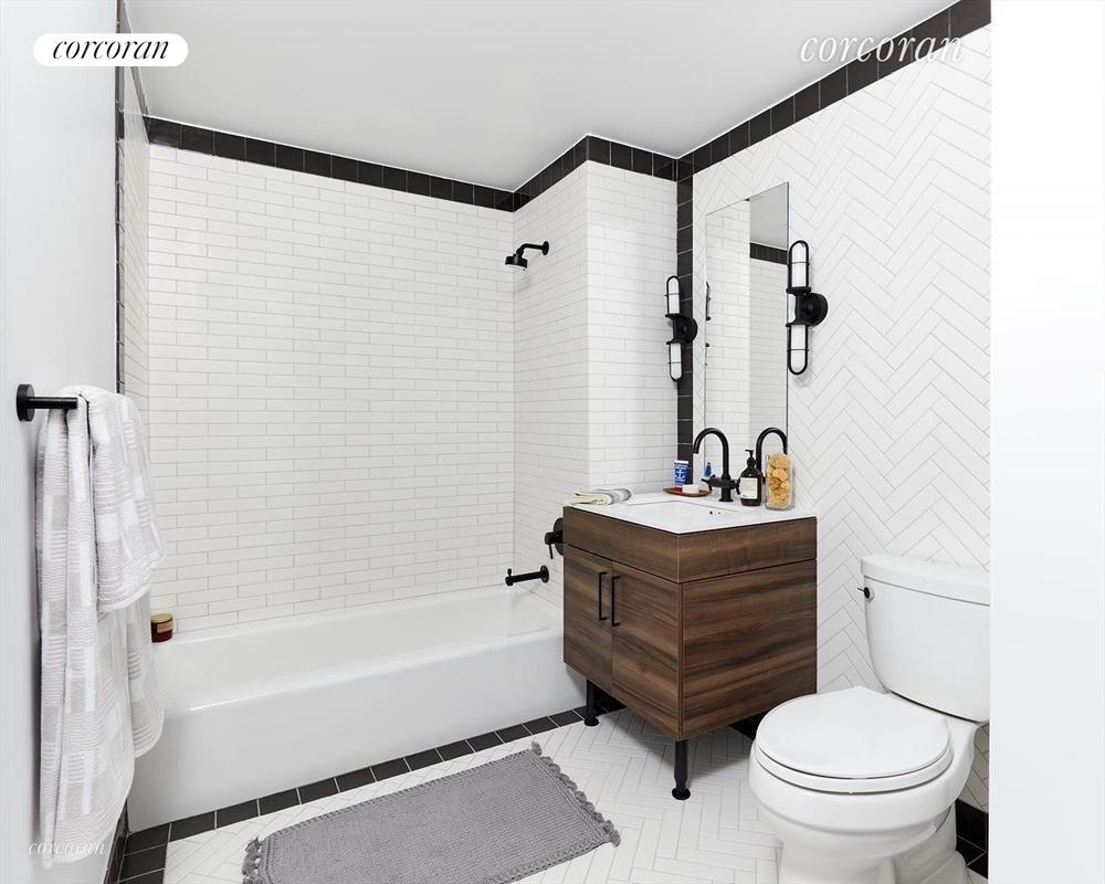 21 India Street, Unit N501 Brooklyn, NY 11222 - Photo 1 of 1 a bathroom with a toilet a sink and a bathtub