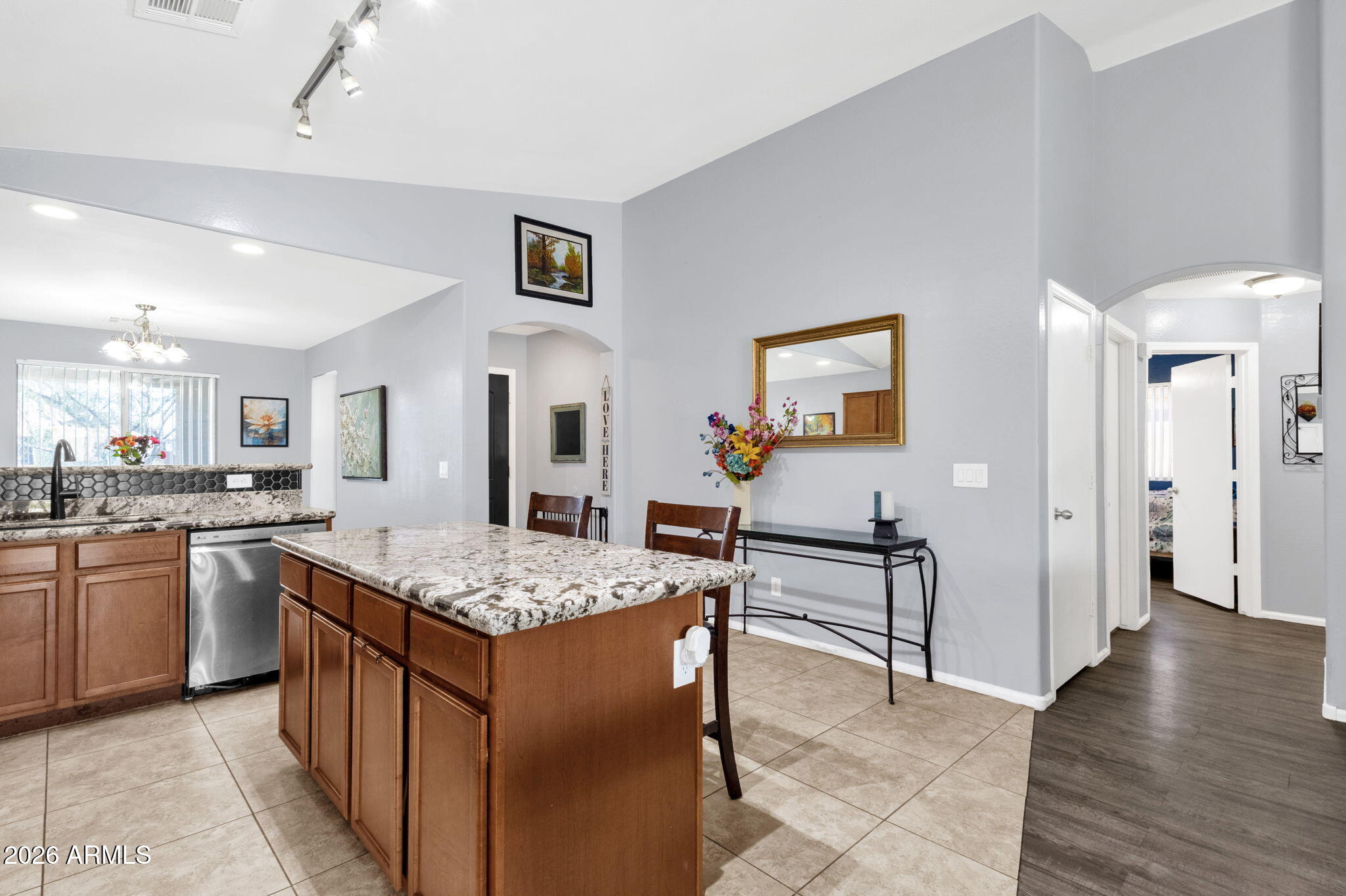 4629 West Carson Road Laveen, AZ 85339 - Photo 12 of 37 a kitchen with stainless steel appliances granite countertop a sink stove and refrigerator