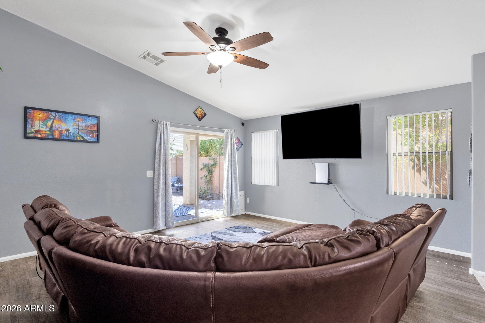 4629 West Carson Road Laveen, AZ 85339 - Photo 15 of 37 a living room with furniture and a flat screen tv