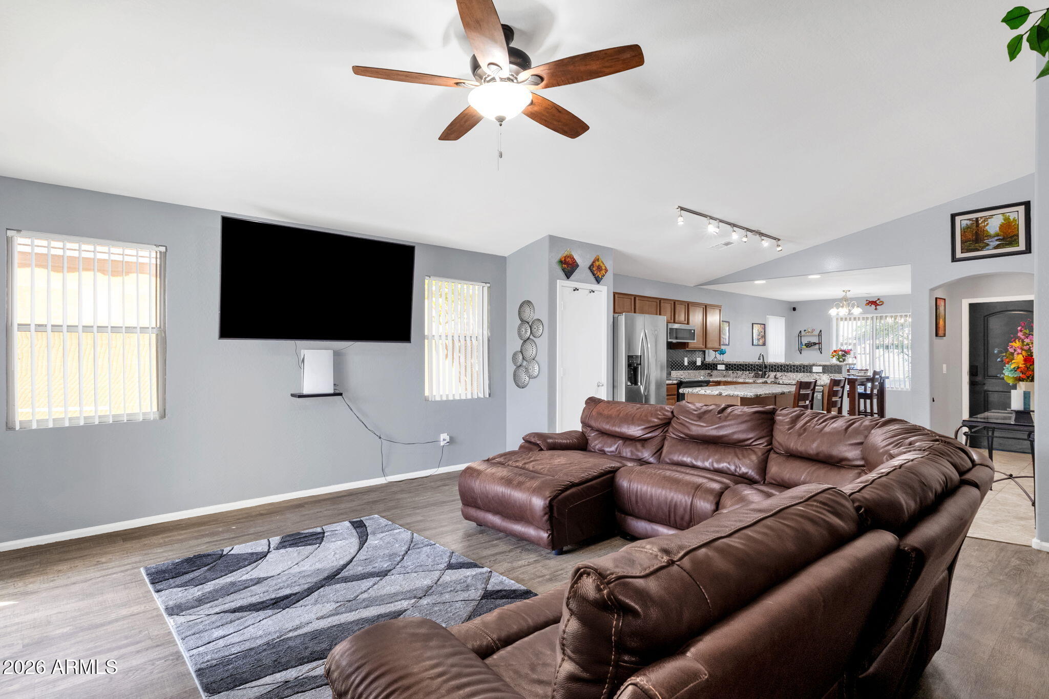 4629 West Carson Road Laveen, AZ 85339 - Photo 16 of 37 a living room with furniture and a flat screen tv