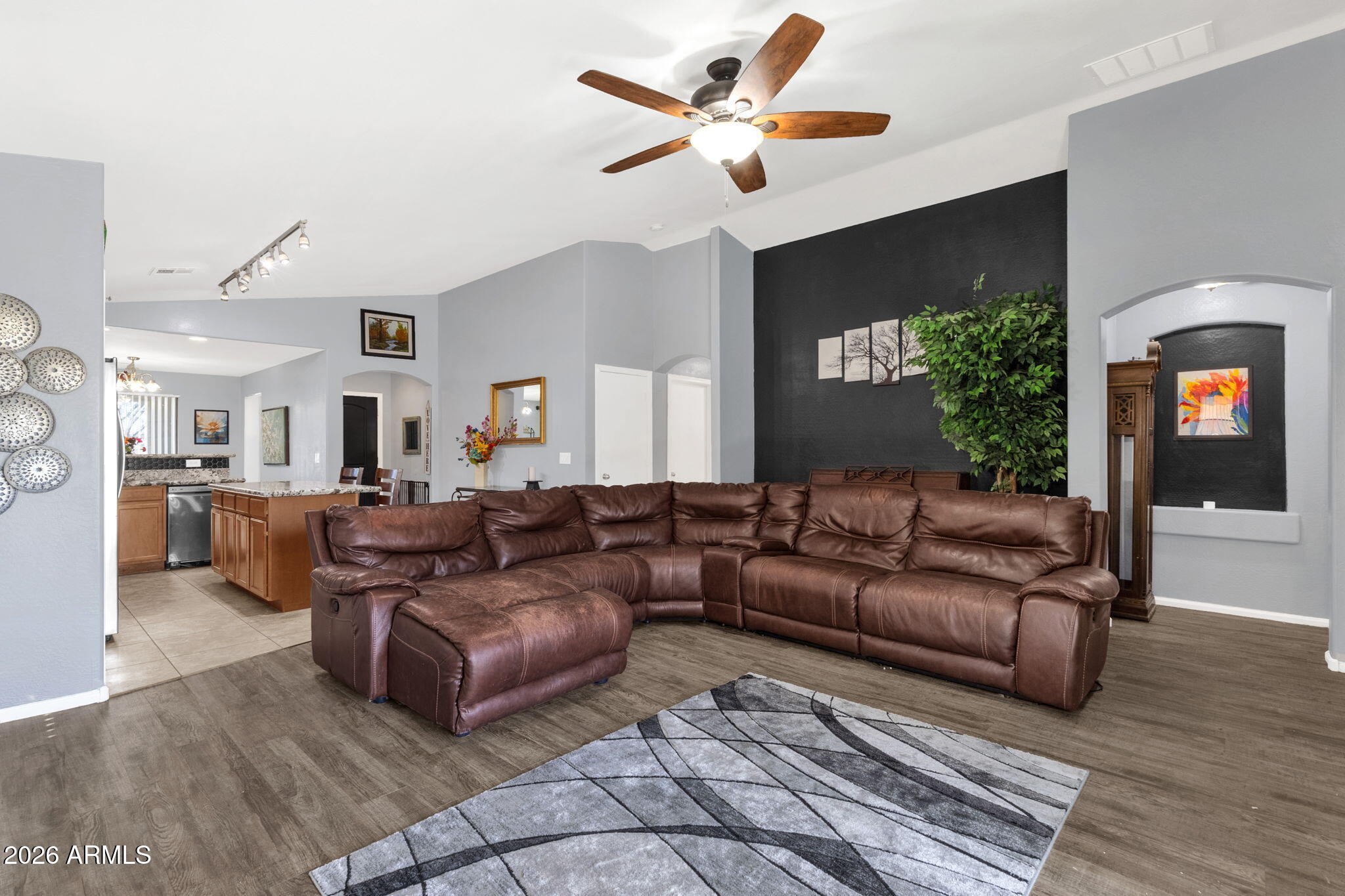 4629 West Carson Road Laveen, AZ 85339 - Photo 17 of 37 a living room with furniture and a fireplace