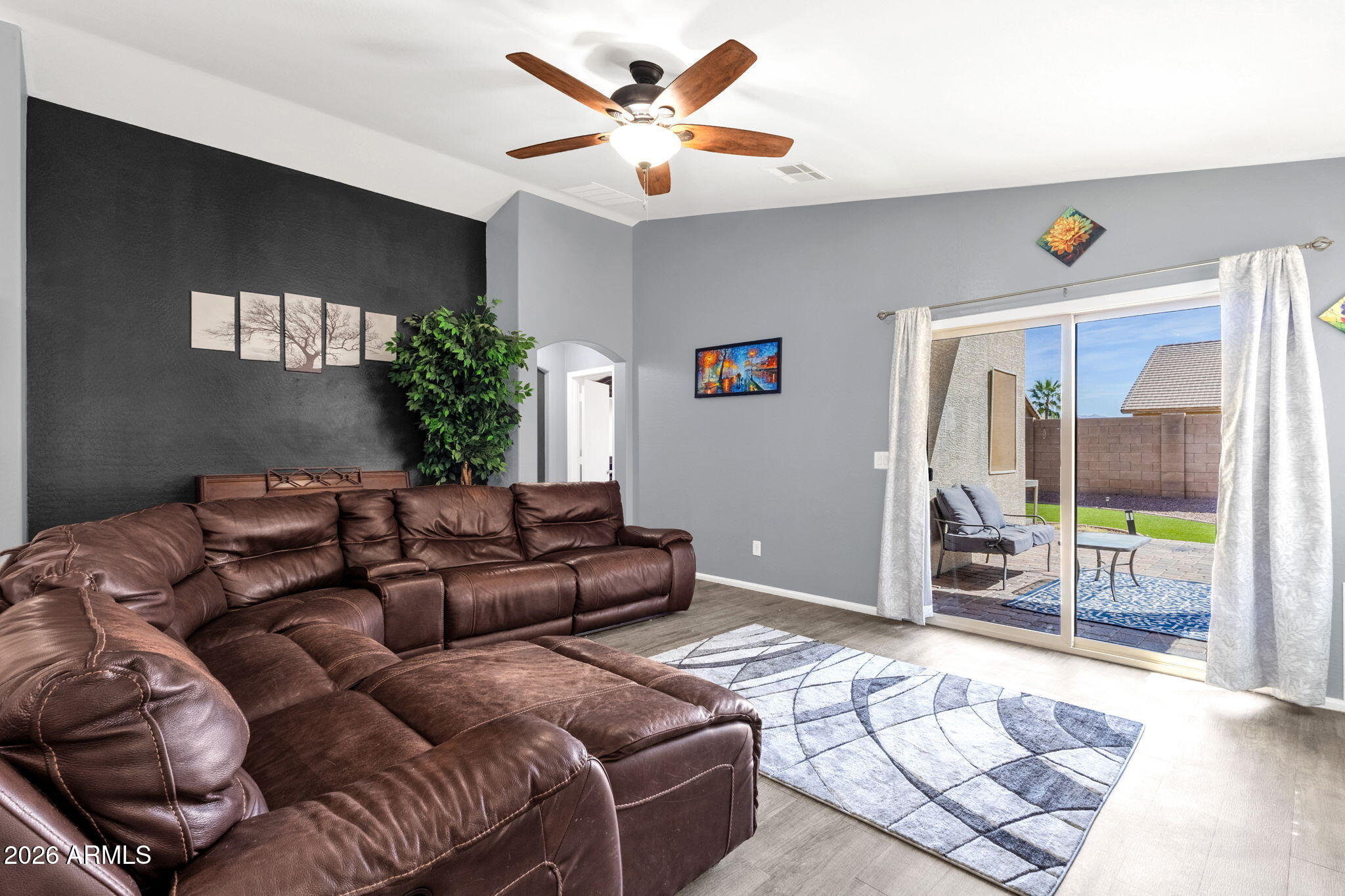 4629 West Carson Road Laveen, AZ 85339 - Photo 18 of 37 a living room with furniture and a large window with garden view