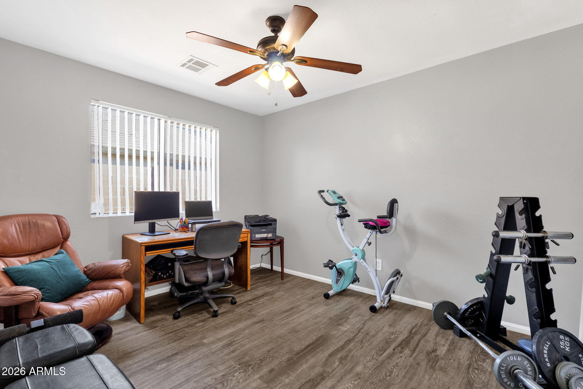 4629 West Carson Road Laveen, AZ 85339 - Photo 21 of 37 a work room with furniture and wooden floor