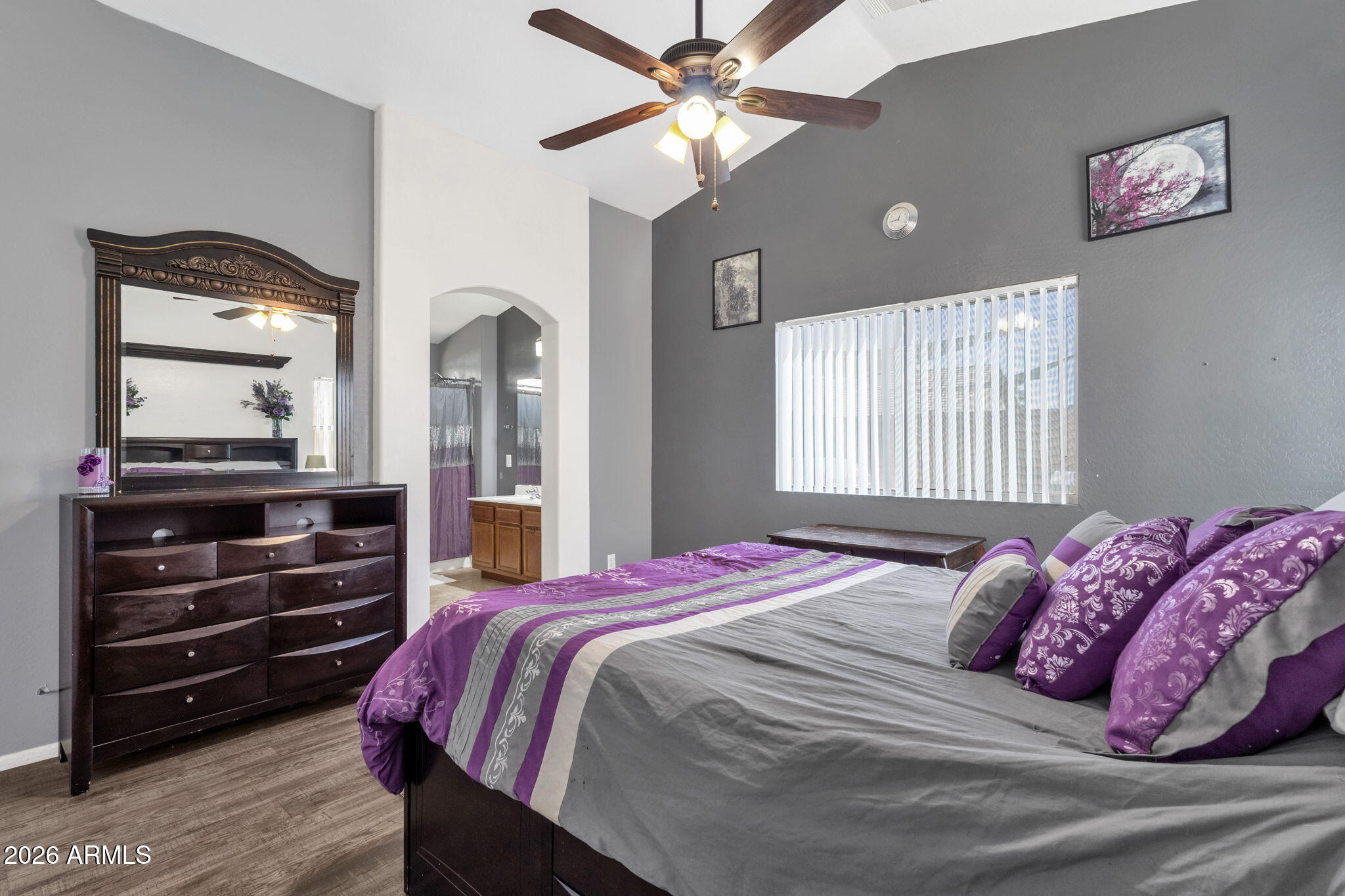 4629 West Carson Road Laveen, AZ 85339 - Photo 23 of 37 a bedroom with a bed and a mirror on the dresser