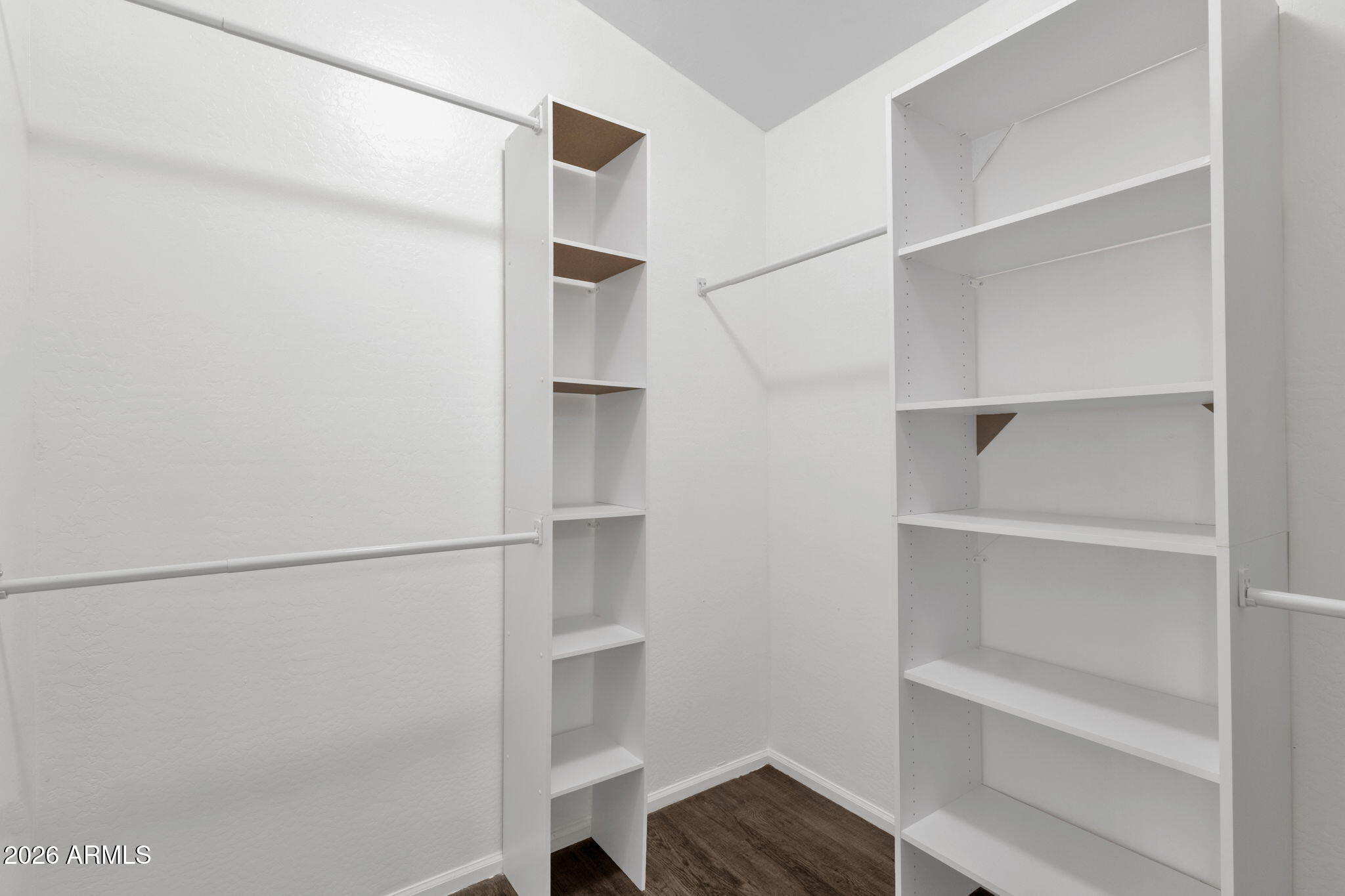 4629 West Carson Road Laveen, AZ 85339 - Photo 27 of 37 a view of walk in closet with empty racks