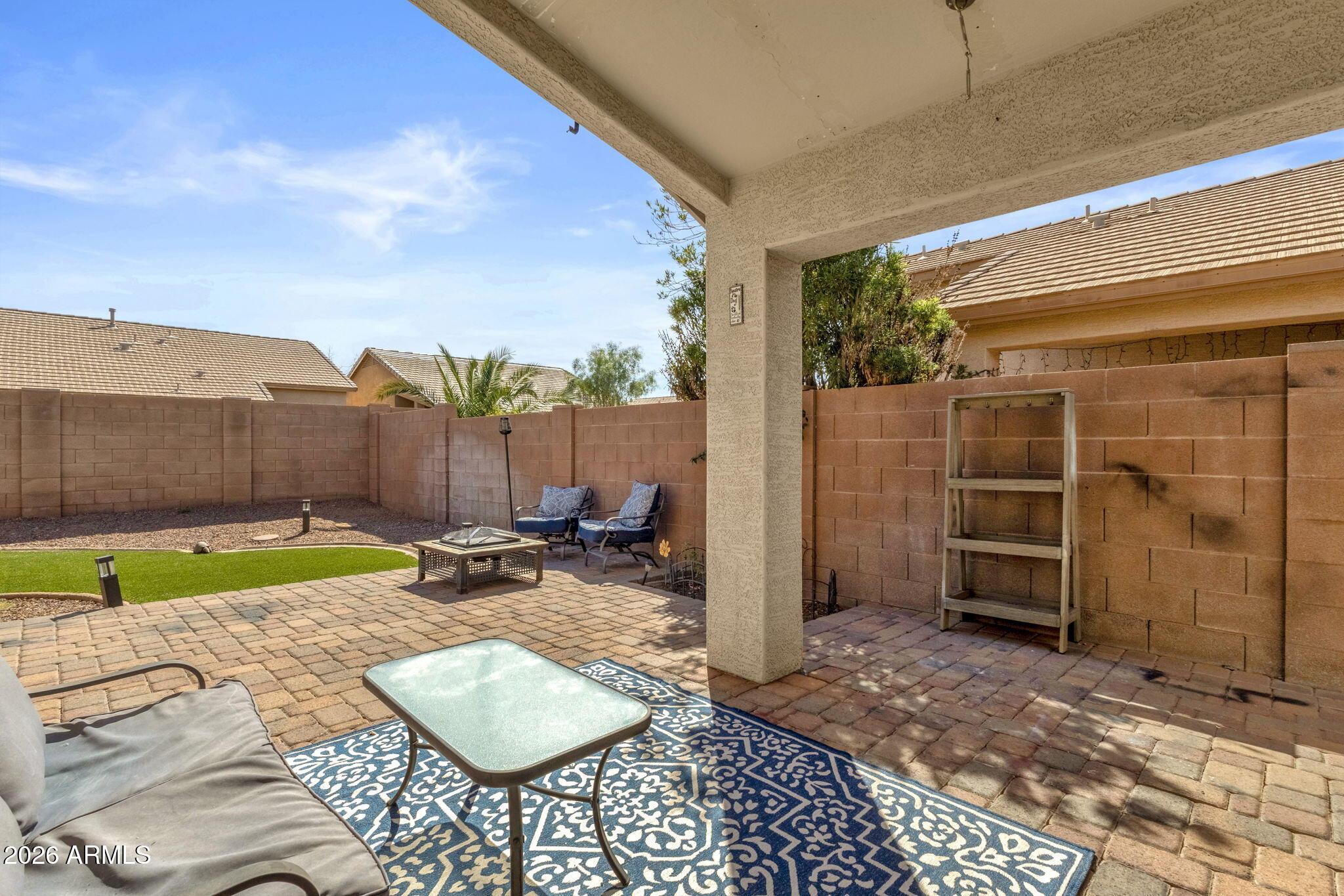 4629 West Carson Road Laveen, AZ 85339 - Photo 30 of 37 a backyard of a house with yard and outdoor seating