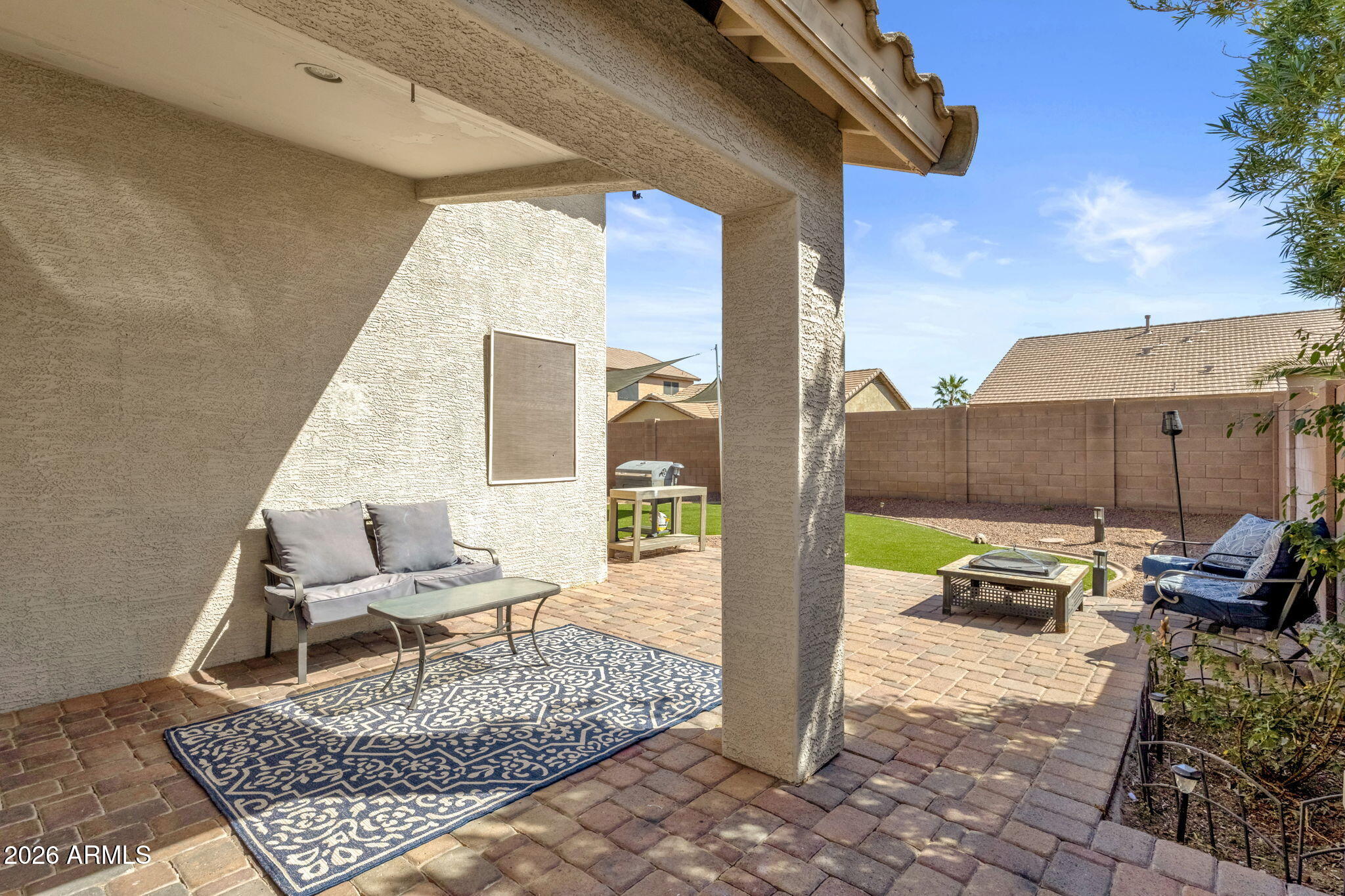 4629 West Carson Road Laveen, AZ 85339 - Photo 31 of 37 a outdoor space with patio the couches and a dining table with garden view