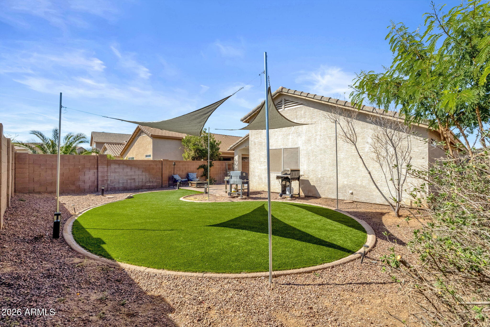 4629 West Carson Road Laveen, AZ 85339 - Photo 35 of 37 a view of a swimming pool with a patio