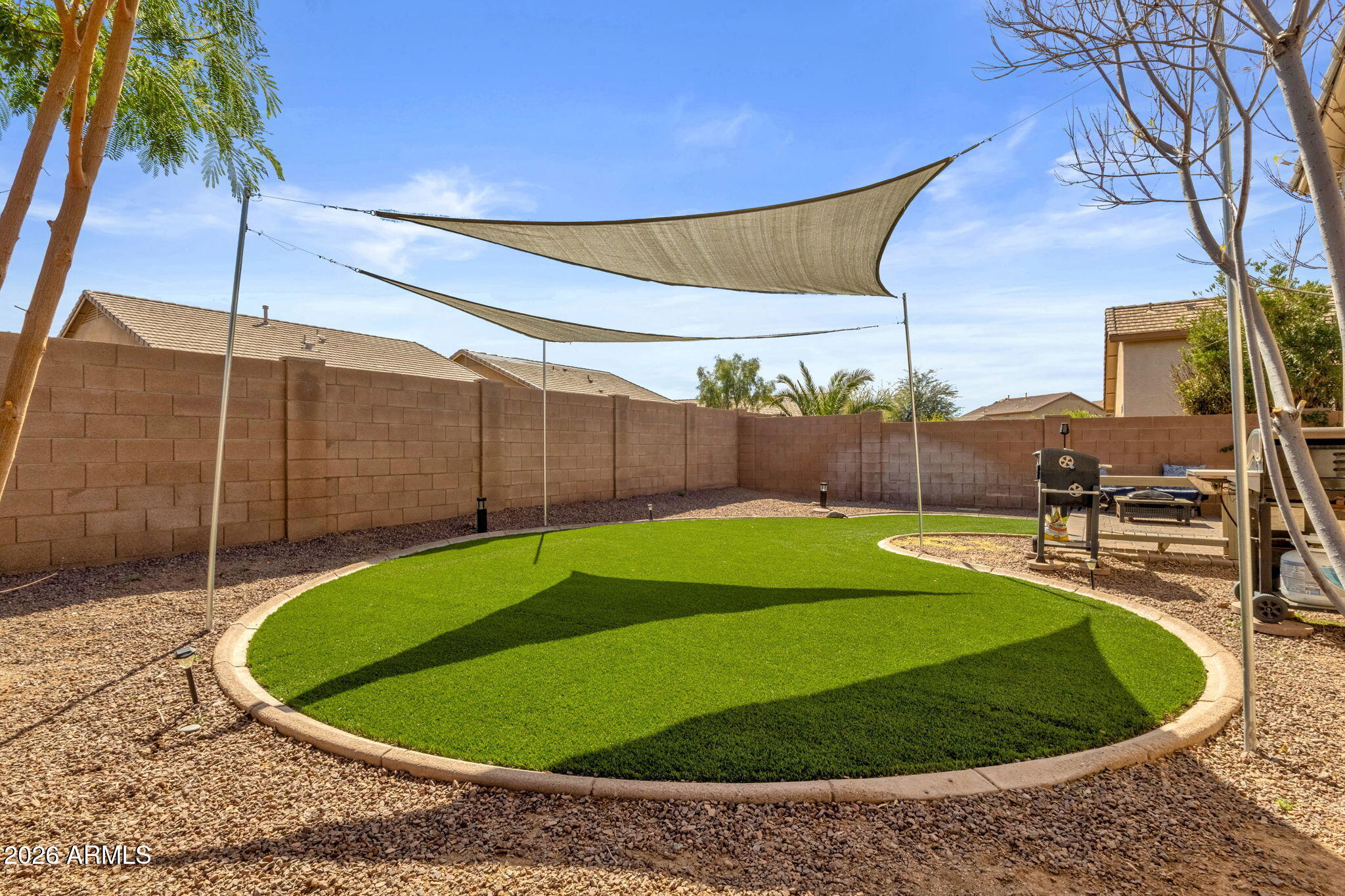 4629 West Carson Road Laveen, AZ 85339 - Photo 36 of 37 a view of a swimming pool with a yard