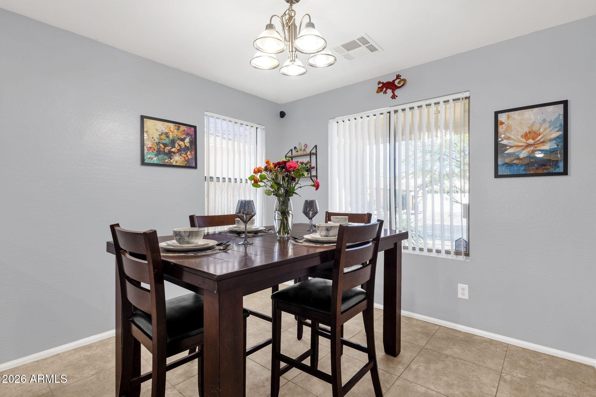 4629 West Carson Road Laveen, AZ 85339 - Photo 8 of 37 a view of a dining room with furniture window and wooden floor