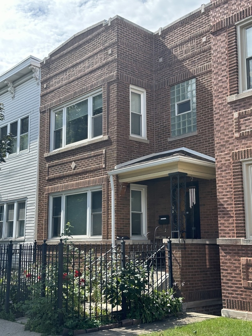 3016 South Throop Street, Unit GARDEN Chicago, IL 60608 - Photo 1 of 13 front view of a brick house