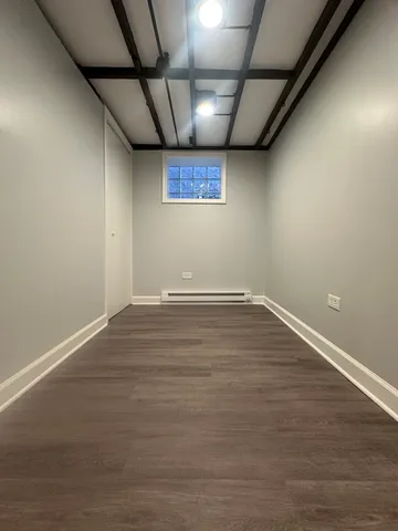 an empty room with hard wood floors