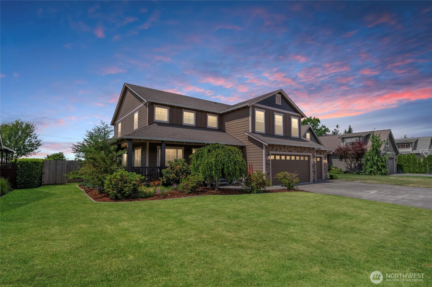1877 Emerald Way Lynden, WA 98264 - Photo 1 of 38 a front view of a house with a yard and potted plants