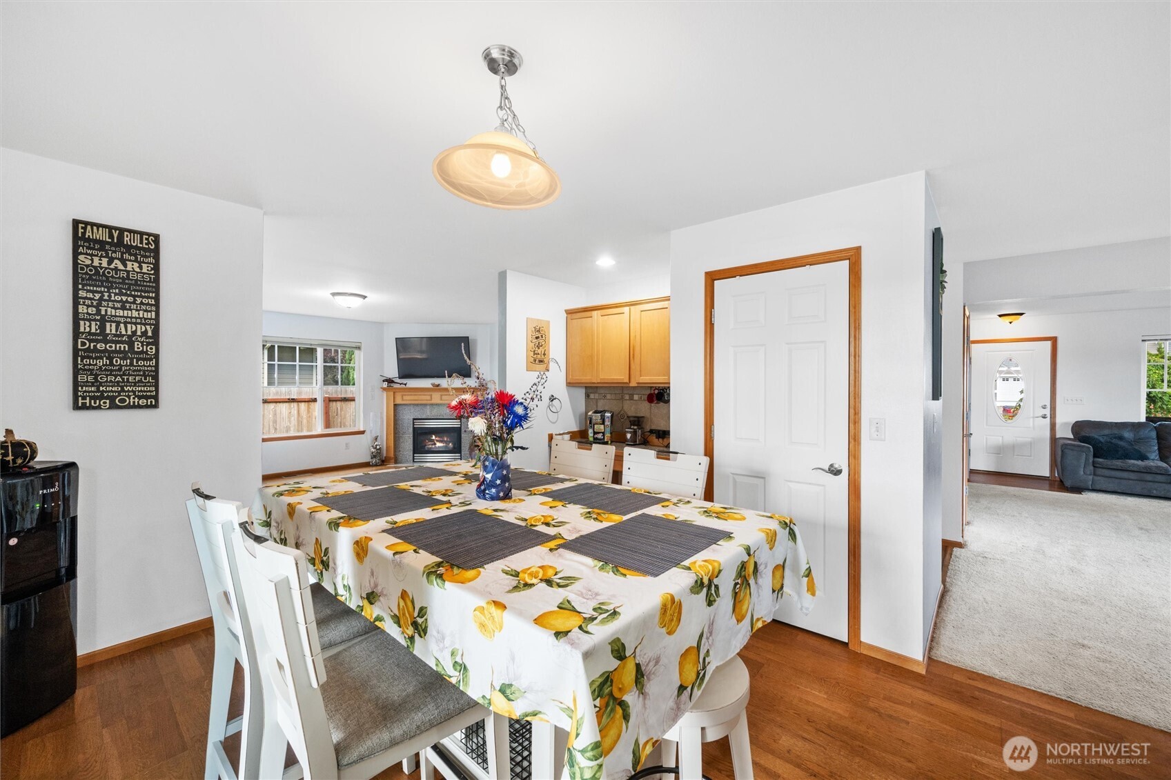 1877 Emerald Way Lynden, WA 98264 - Photo 13 of 38 a view of a dining room with furniture and wooden floor
