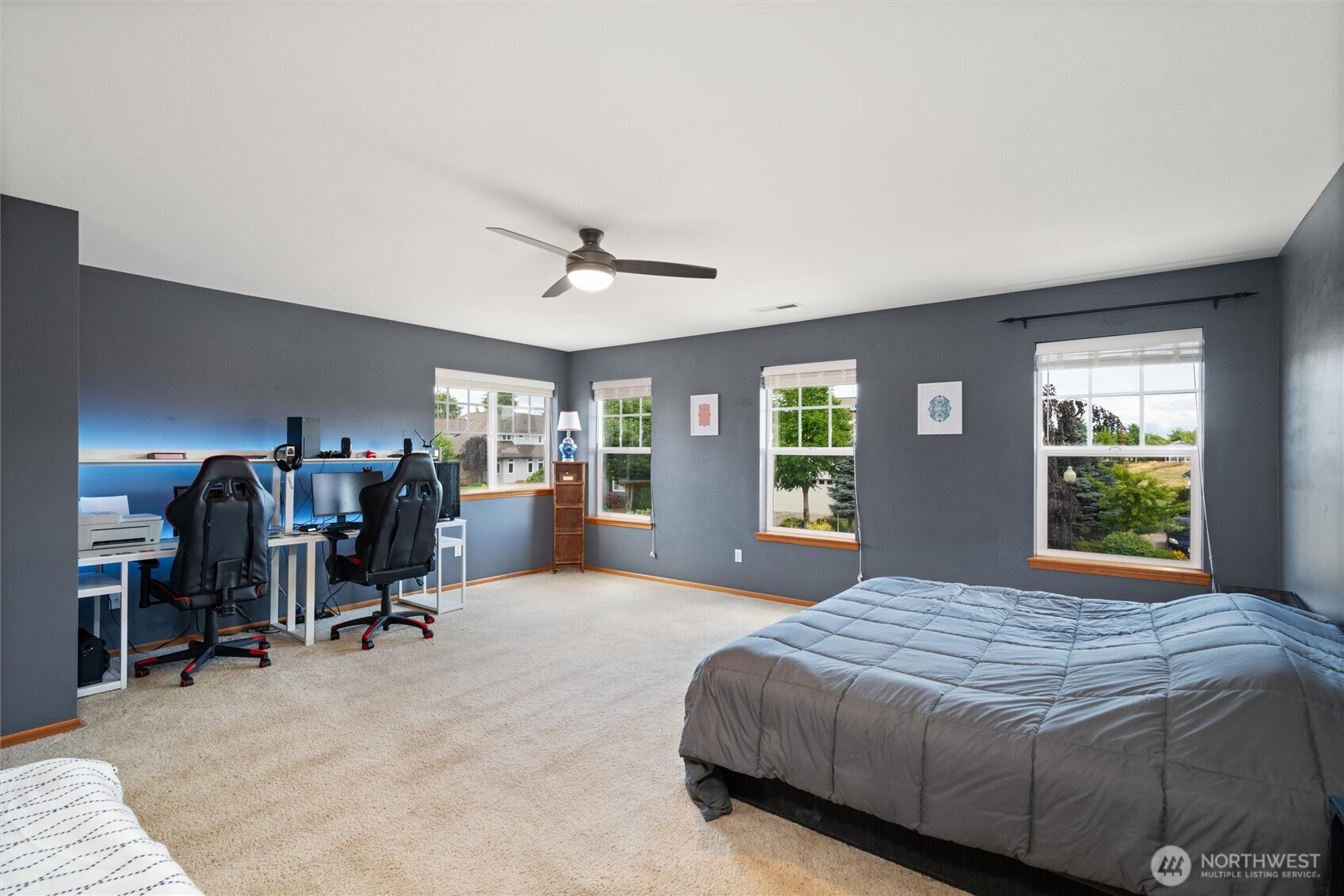 1877 Emerald Way Lynden, WA 98264 - Photo 19 of 38 a bedroom with a large bed and a large window