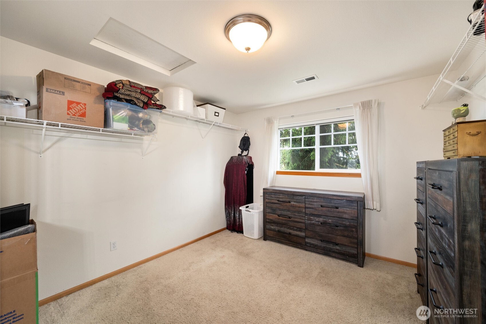 1877 Emerald Way Lynden, WA 98264 - Photo 23 of 38 a view of walk in closet with clothes and shoes