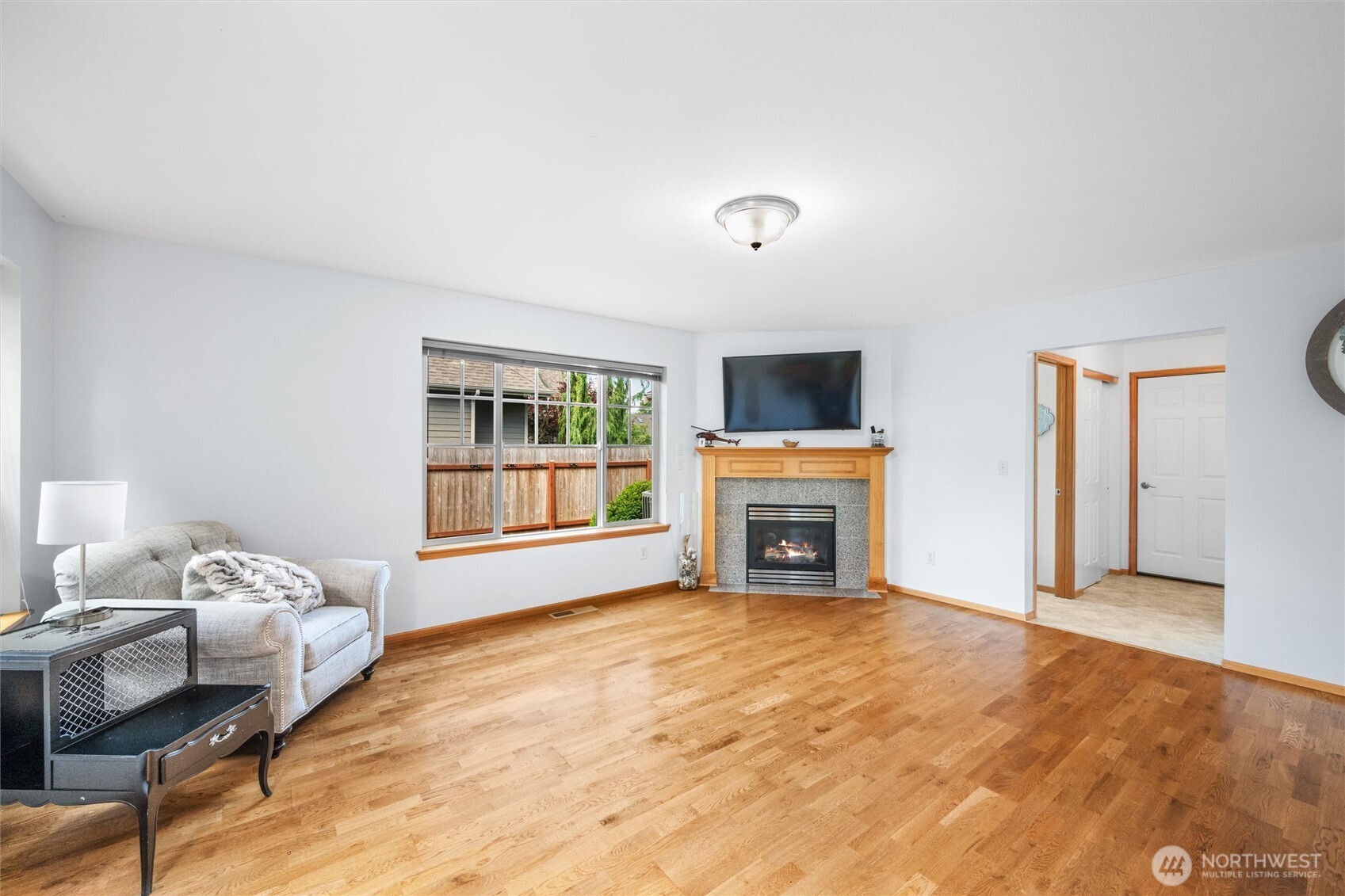 1877 Emerald Way Lynden, WA 98264 - Photo 8 of 38 a view of a bedroom with a bed and a fireplace