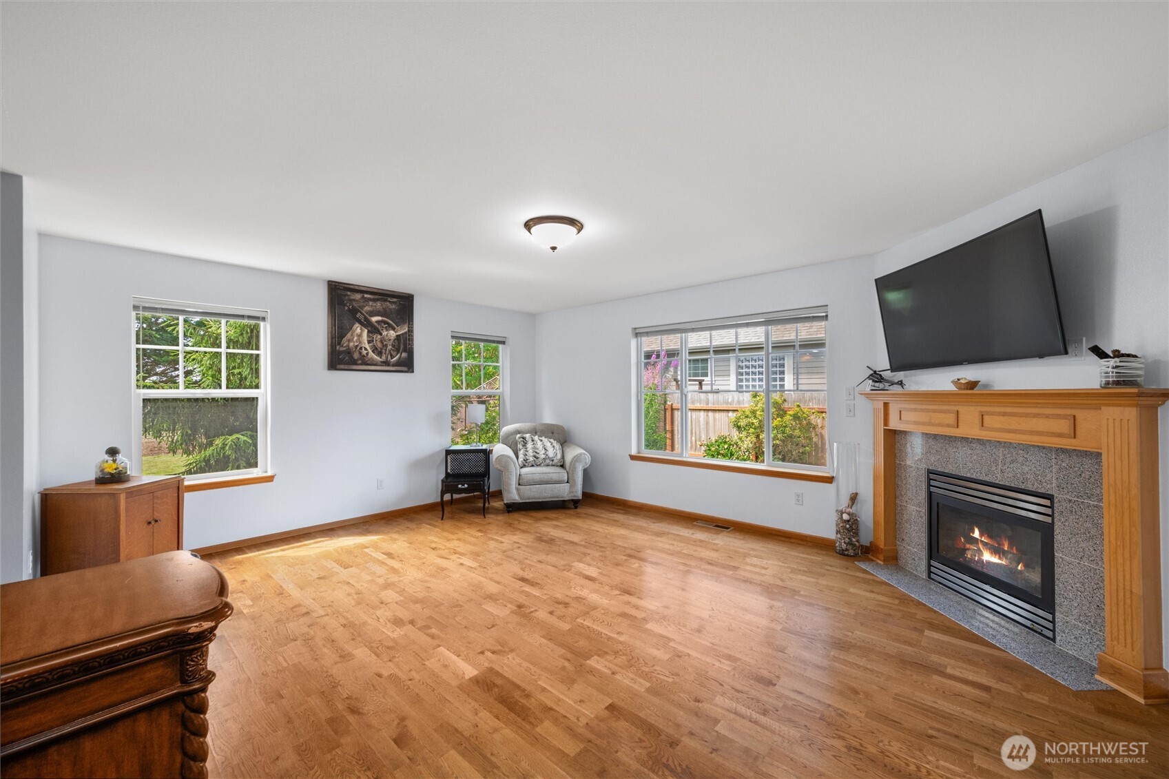 1877 Emerald Way Lynden, WA 98264 - Photo 9 of 38 a living room with furniture and a flat screen tv