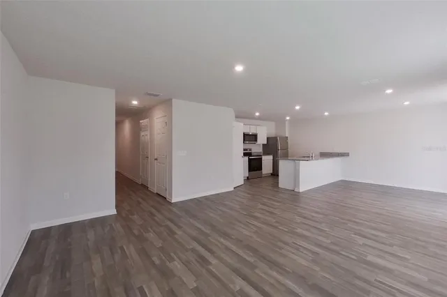 a view of kitchen with wooden floor