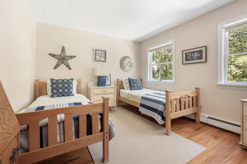 a bedroom with furniture and a window