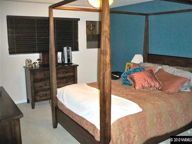 550 Nancy Circle, Unit 1 Reno, NV 89503 - Photo 8 of 10 a bedroom with a bed and dresser