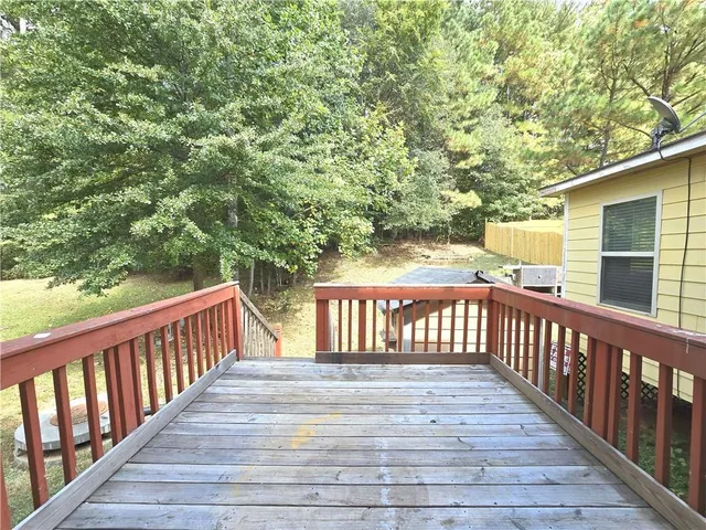 a view of balcony with wooden floor
