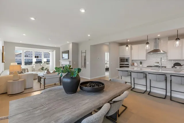 a kitchen with a sink appliances and living room