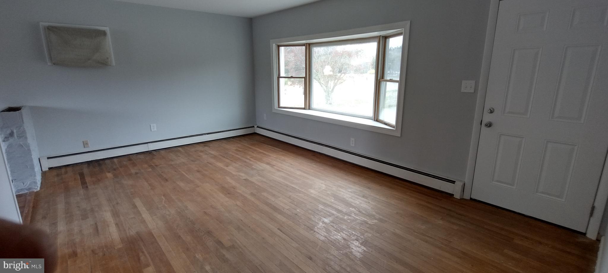 25853 Quinton Road Mardela Springs, MD 21837 - Photo 19 of 53 a view of a room with wooden floor and window