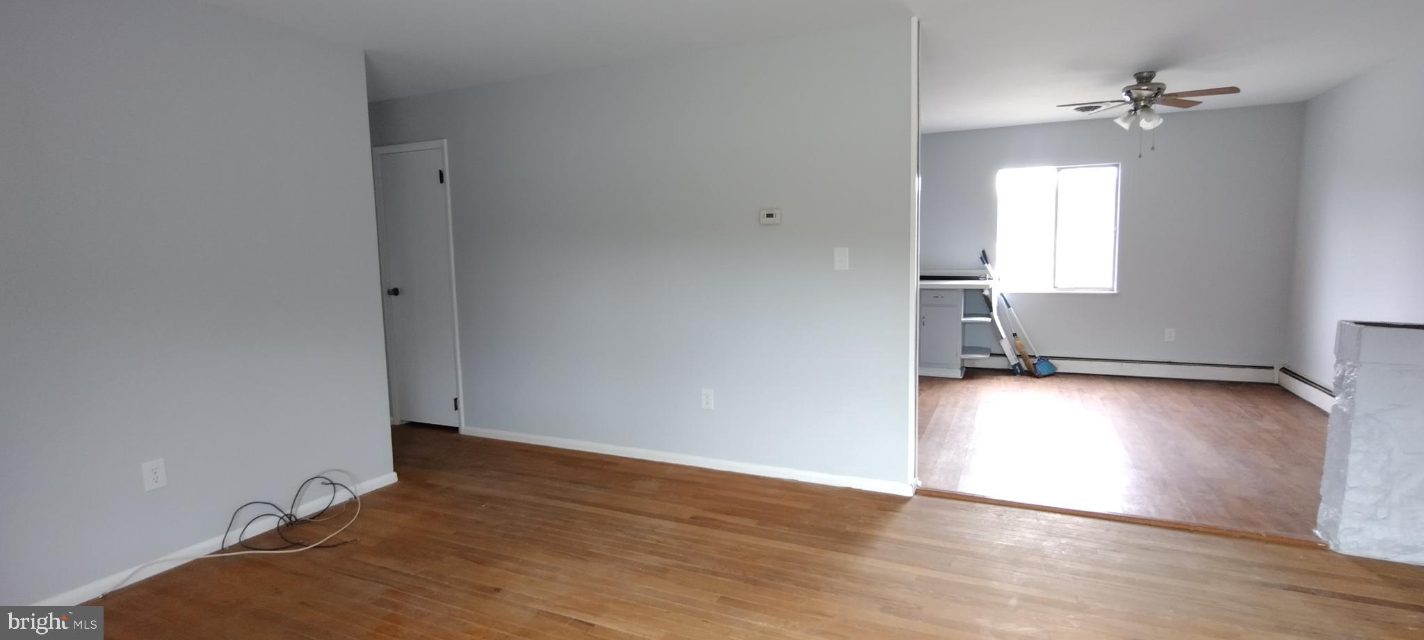 25853 Quinton Road Mardela Springs, MD 21837 - Photo 27 of 53 an empty room with wooden floor and windows