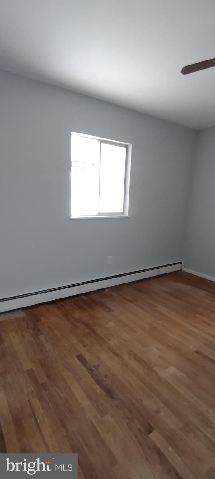 25853 Quinton Road Mardela Springs, MD 21837 - Photo 33 of 53 an empty room with wooden floor and windows