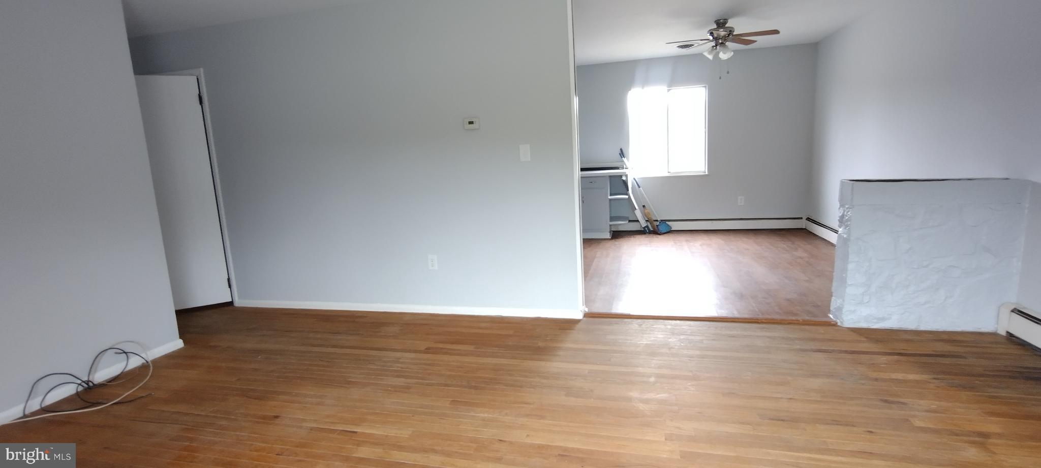 25853 Quinton Road Mardela Springs, MD 21837 - Photo 34 of 53 an empty room with wooden floor and windows