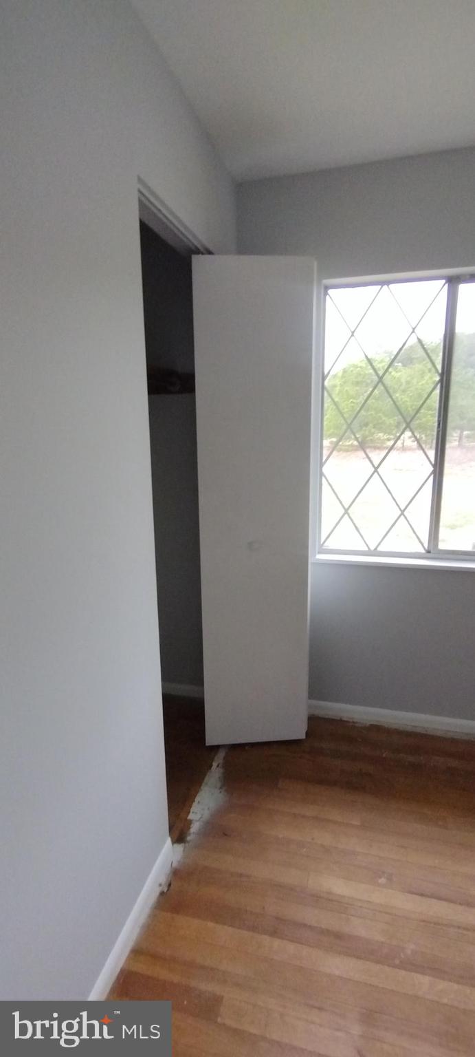 25853 Quinton Road Mardela Springs, MD 21837 - Photo 37 of 53 an empty room with wooden floor and windows