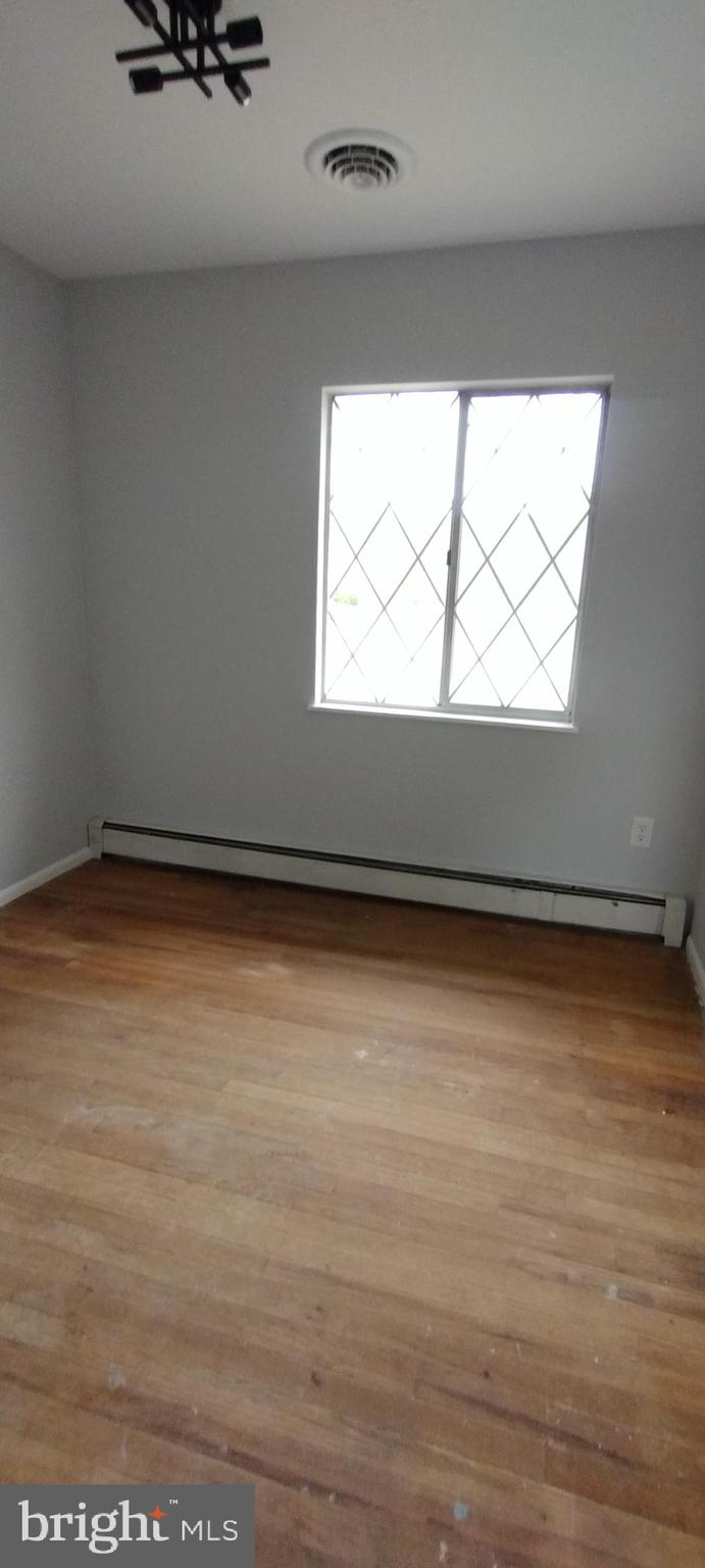 25853 Quinton Road Mardela Springs, MD 21837 - Photo 39 of 53 a view of a room with wooden floor and white walls
