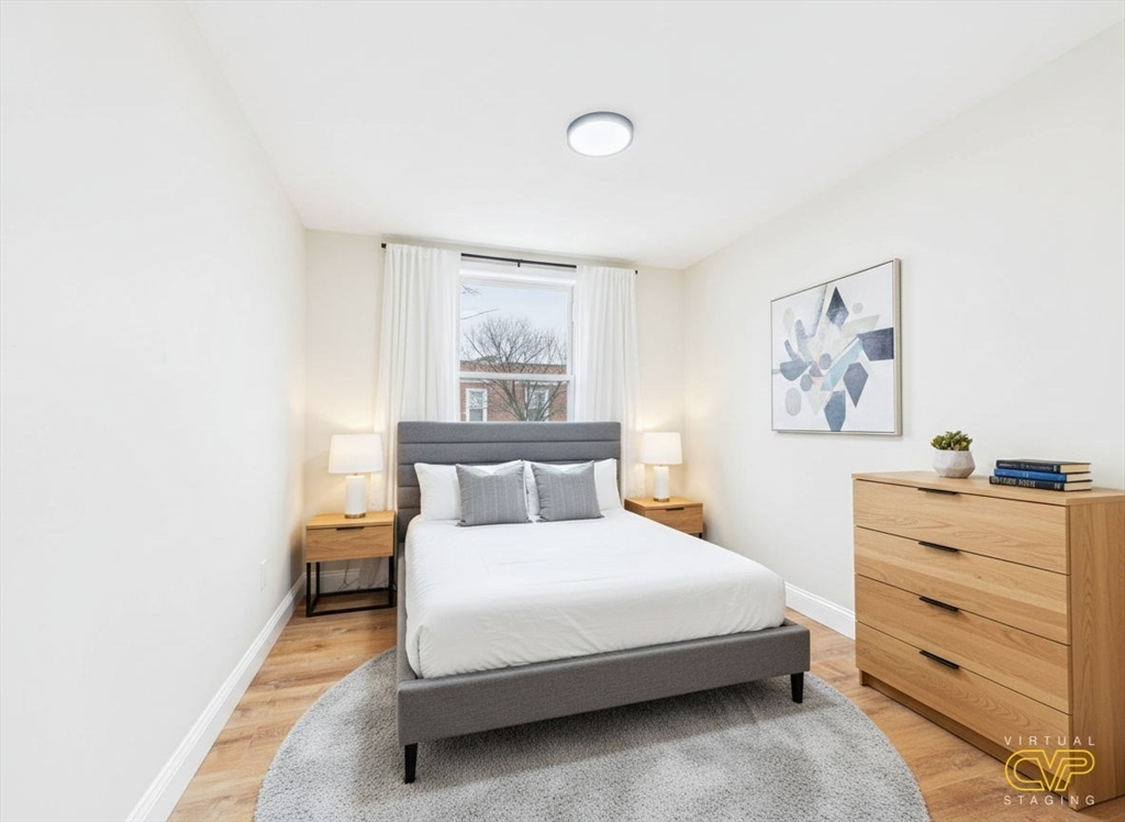 24 Middle Street Fairhaven, MA 02719 - Photo 15 of 38 a bedroom with a bed and cabinet